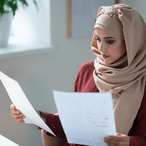 A small business owner reviews certified tax filings, using Arabic Translation Services in Pennsylvania for finance.