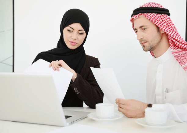 A manager reviews a certified contract draft, using Arabic Translation Services in Pennsylvania for business compliance.