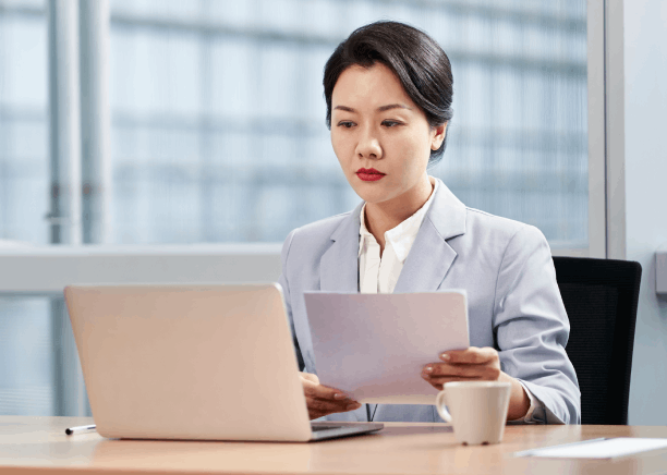 Translator working on business contracts during legal document translation in Pennsylvania for international communication.