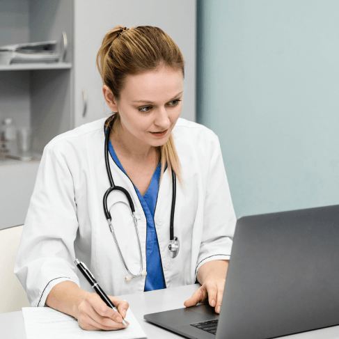 A doctor signs an NDA beside medical files, providing Spanish Translation Services in Pennsylvania for certified.