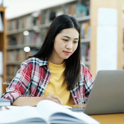 A student reviews a translated transcript packet for Spanish Translation Services in Pennsylvania for academic records.