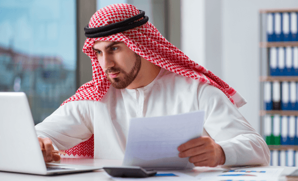 A project manager reviews a contract proof, coordinating Arabic Translation Services in Pennsylvania for a business client.