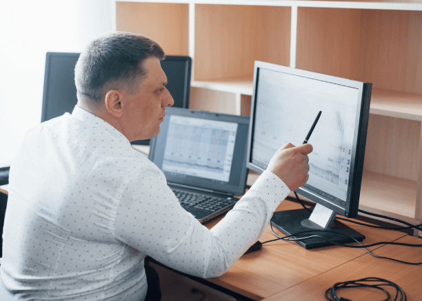 An engineer checks a CAD manual using Chinese Translation Services in Pennsylvania for technical document accuracy.