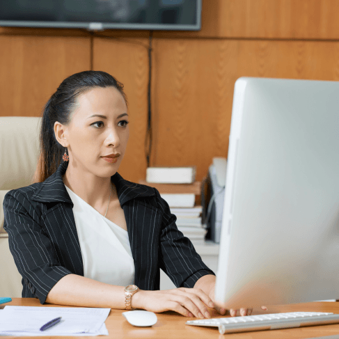 A translator prepares a certified USCIS packet using Chinese Translation Services in Pennsylvania, checking names and seals.