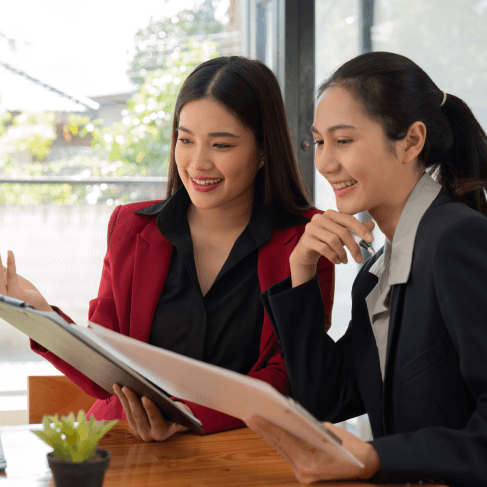 Two linguists review a bilingual contract with Vietnamese Translation Services in Pennsylvania to file a court-ready exhibit.